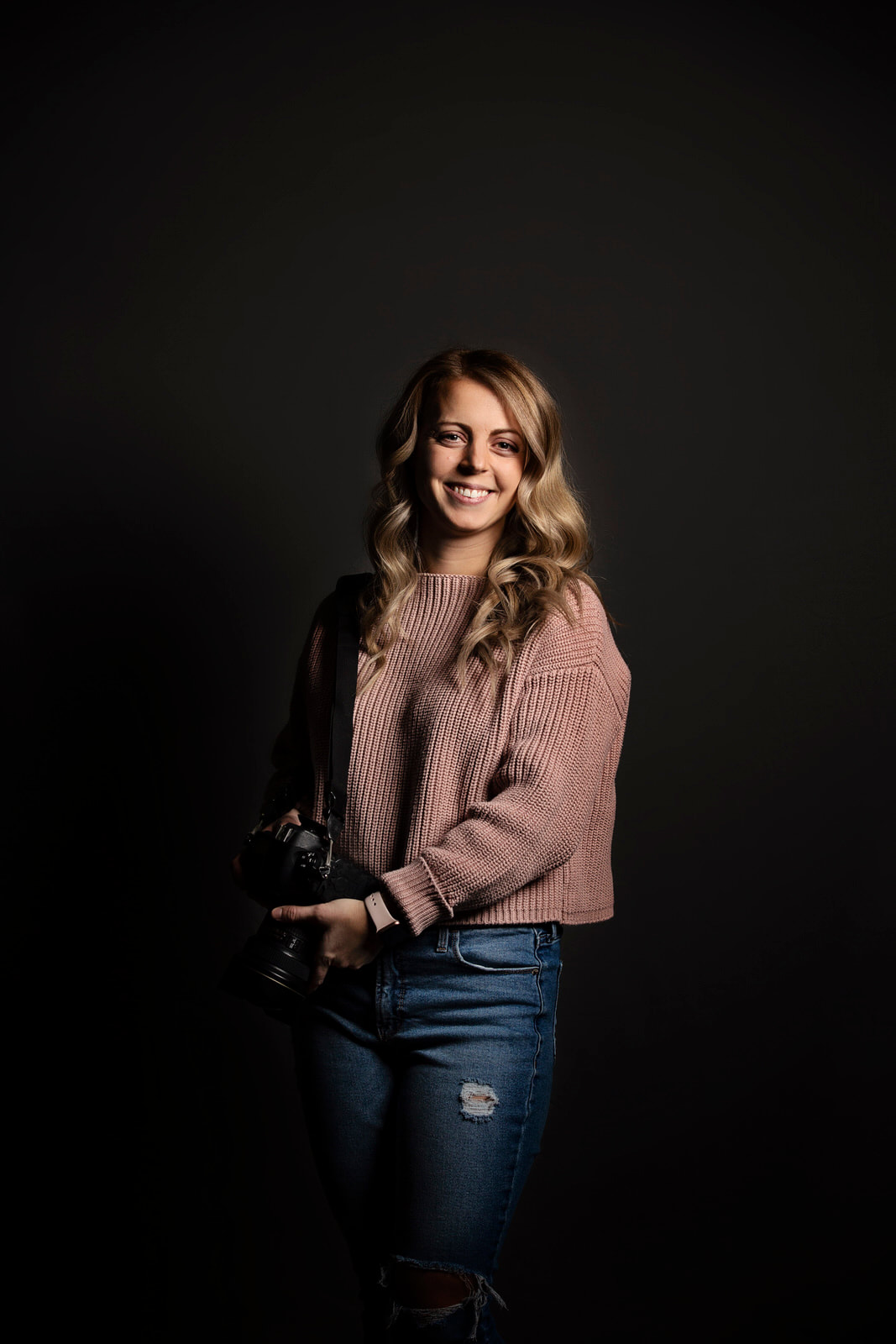 Photo of woman in pink sweater and jeans. Edmonton Portrait Photographer