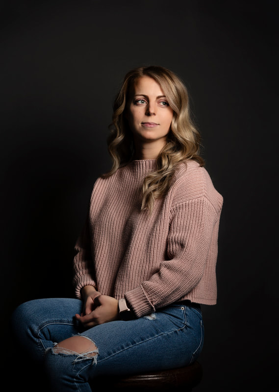Photo of woman in pink sweater and jeans. Edmonton Portrait Photographer
